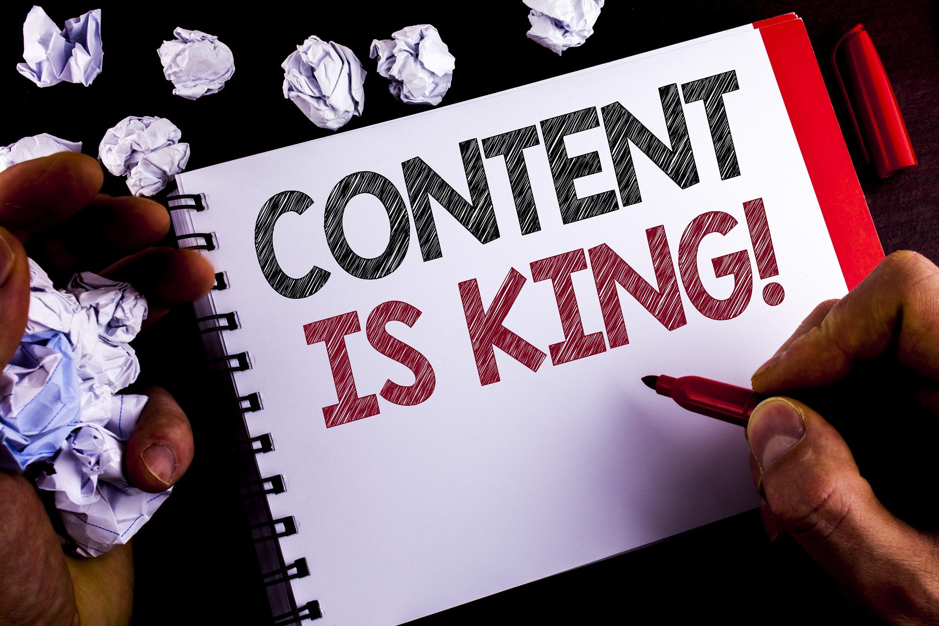 Writing note showing Content Is King Motivational Call. Business photo showcasing Strategy online internet digital seo written by Man on Notepad holding Marker wooden background Paper Balls Content Creation Support